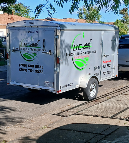DC Landscape & Maintenance branded trailer — Lic #60732